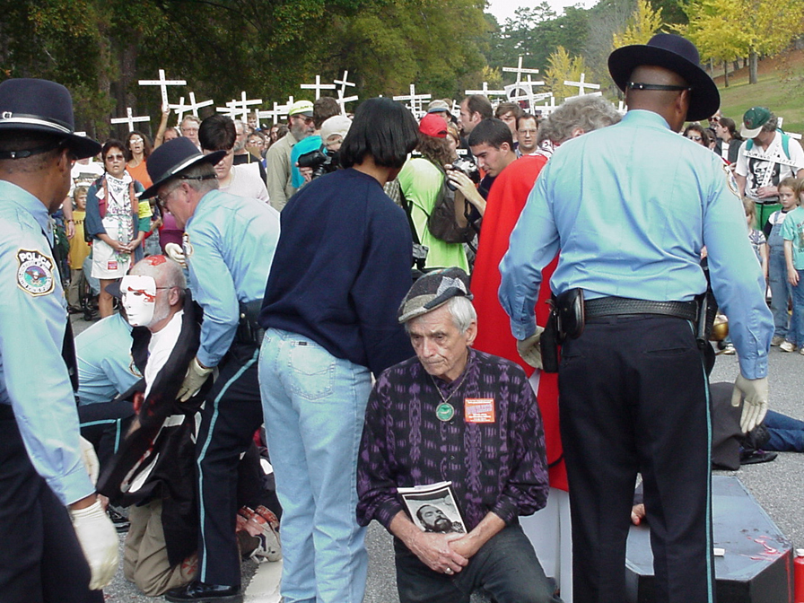 Berrigan kneeling